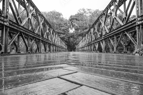 Old truss bridge over Sazava River. Black and white image.