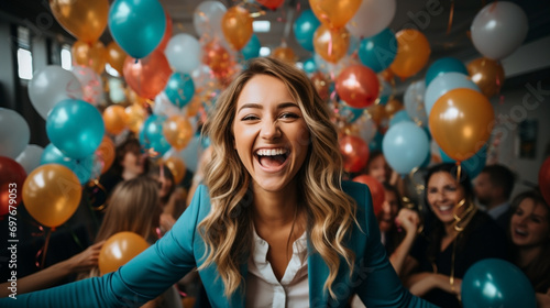 A happy mood laughing cheerful girl of an office team in front of their team, taking a selfie photo in a celebrity party event with lot of colorful balloons around  photo