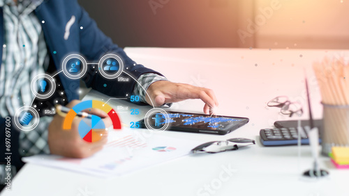Photographs of investment management using modern technology with an AI data management system for business people, a process for managing the entire year's financial plan, customized by computer.
