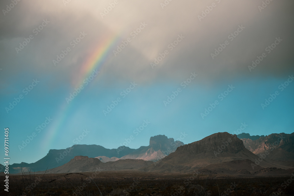 Rainbow Arches Over Chisos Mountains In Big Bend
