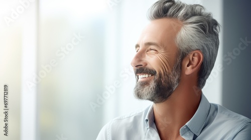 Caucasian middle aged smiling man in trendy casual clothes head shot portrait. Positive happy guy feels optimistic. Handsome confident mature good looking male laughing feeling excited close up shot.. photo