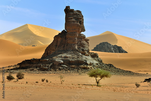 SAND DUNES AND ROCK FORMATIONS IN THE REGION OF TADRART ROUGE IN THE SAHARA DESERT IN ALGERIA