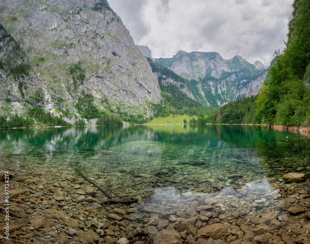 The crystal clear water of the Obersee in Berchtesgaden invite to to relax and reload all batteries