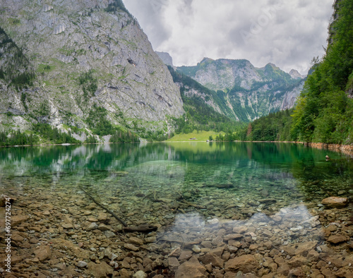 The crystal clear water of the Obersee in Berchtesgaden invite to to relax and reload all batteries