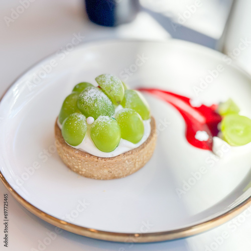 Closeup of Homemade grape and cheese cream on pastry pie. Selective focus concept.