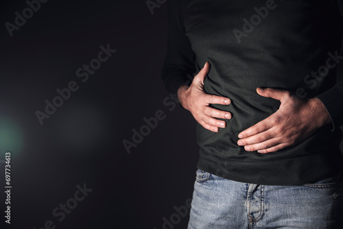 a man has a stomach ache photo
