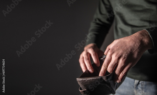 man showing empty wallet