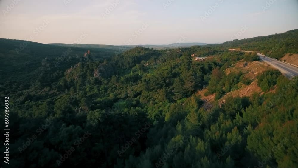 drone view of red car driving on forest road drone view of red car driving on forest road