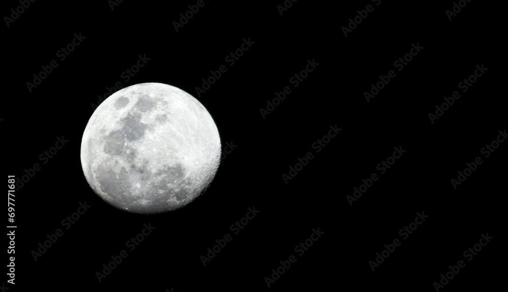Full detail moon closeup on a black background with stars visible Full detail moon closeup on a black background with stars visible