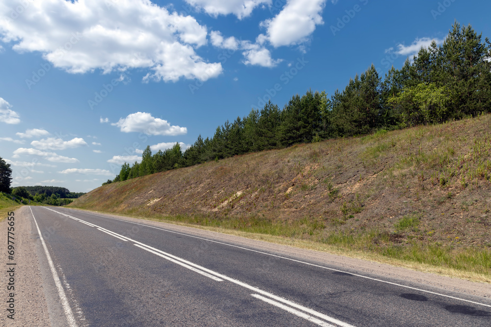 Naklejka premium small hills through which the highway passes