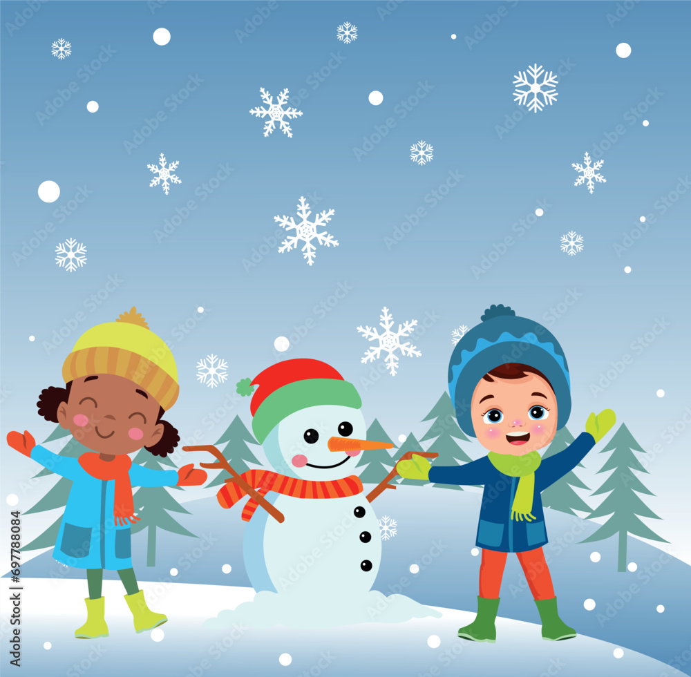 Children making snowmen playing outdoors in winter Children making snowmen playing outdoors in winter