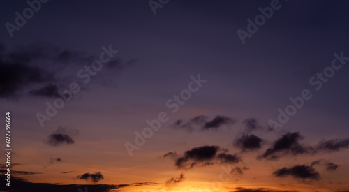 Sunset Sky Background,Beautiful Morning Sunrise with colorful Yellow,Orange,Purple,Blue and Cloud on Spring,Nature Panoramic Landscape Golden hour or Romantic Summer Sky © Anchalee