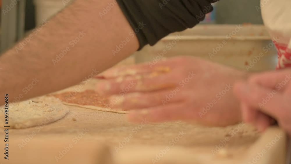Cook Fill the minced meat into the dough to make pita Cook Fill the minced meat into the dough to make pita