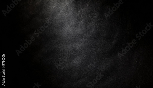 Crumpled and Rough black paper texture with a detailed texture for background with harsh light.
