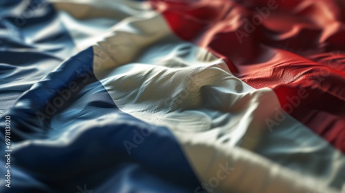 Flag of France. Closeup beautifully folded French tricolor made of fabric photo