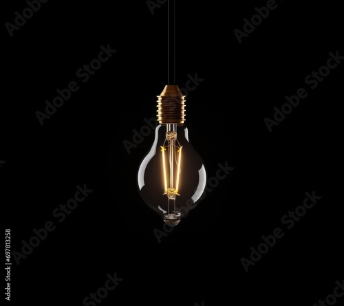 a light bulb is illuminated on a dark background