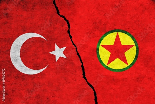 Turkey and PKK painted flags on a wall with a crack. Turkey and PKK conflict. Turkey and PKK war. Turkey vs PKK photo