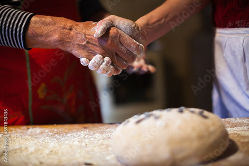 Adult Woman's Hands Shaking at the Culmination of Crafting Traditional Bread Dough