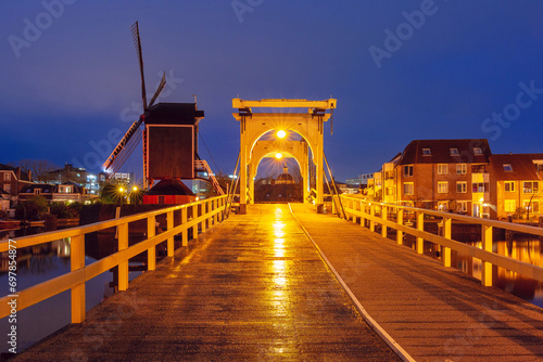 Leiden canal Galgewater with De Put windmill and Rembrandt Bridge, South Holland, Netherlands photo