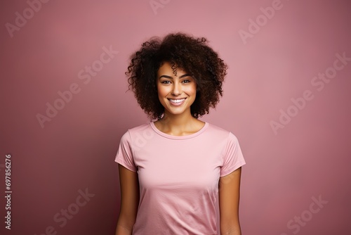 Young Woman Smiling and Wearing a Blank Pink T-shirt Standing in Front of a Pink Background, Print on Demand Template, Fashion Portrait, People Wearing Clothing with Print Copy Space