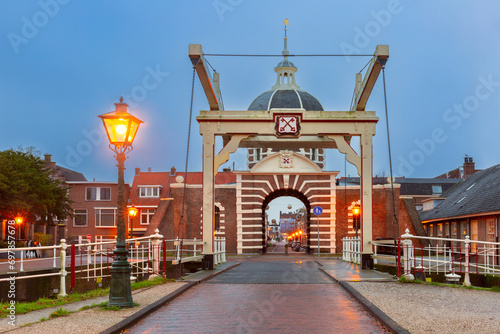 City gate and Bridge Morspoort in Leiden during blue hour, South Holland, Netherlands photo