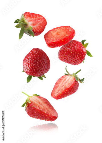 Fresh ripe strawberries falling on white background photo