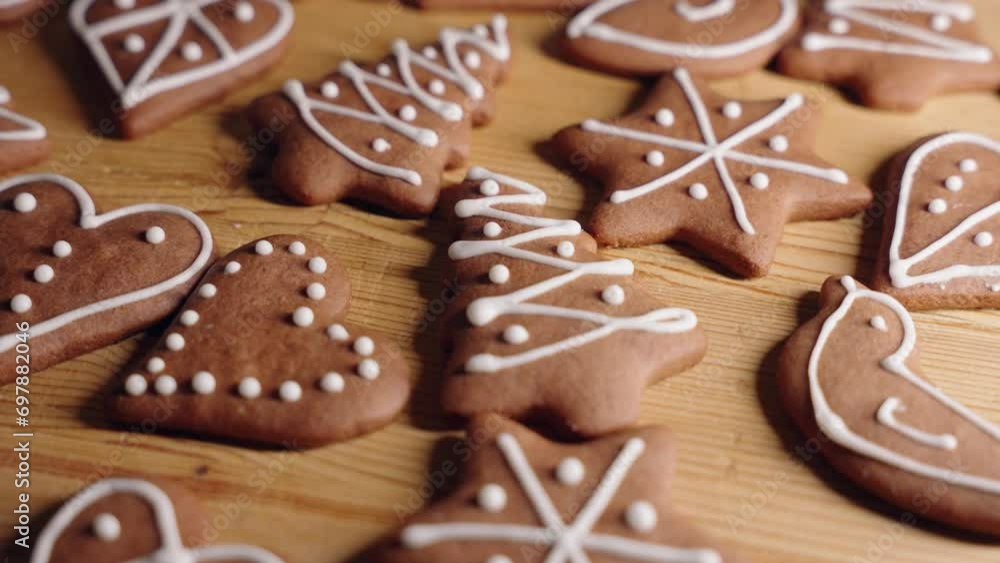 Decorating Gingerbread Cookies for Christmas, Closeup Macro Shot Making handmade festive new year sweets and cookies with white glaze icing. Christmas and new year traditions Decorating Gingerbread Cookies for Christmas, Closeup Macro Shot Making handmade festive new year sweets and cookies with white glaze icing. Christmas and new year traditions