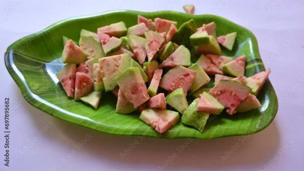 Slices of Guava. It is is a common tropical fruit. Its other names common guava, Psidium guajava, lemon guava, apple guava. This is is a small tree in the myrtle family. Ripe Guava. Slices of Guava. It is is a common tropical fruit. Its other names common guava, Psidium guajava, lemon guava, apple guava. This is is a small tree in the myrtle family. Ripe Guava.