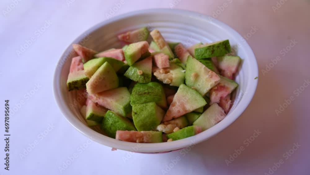 Slices of Guava. It is is a common tropical fruit. Its other names common guava, Psidium guajava, lemon guava, apple guava. This is is a small tree in the myrtle family. Ripe Guava.
Slices of Guava. It is is a common tropical fruit. Its other names common guava, Psidium guajava, lemon guava, apple guava. This is is a small tree in the myrtle family. Ripe Guava.