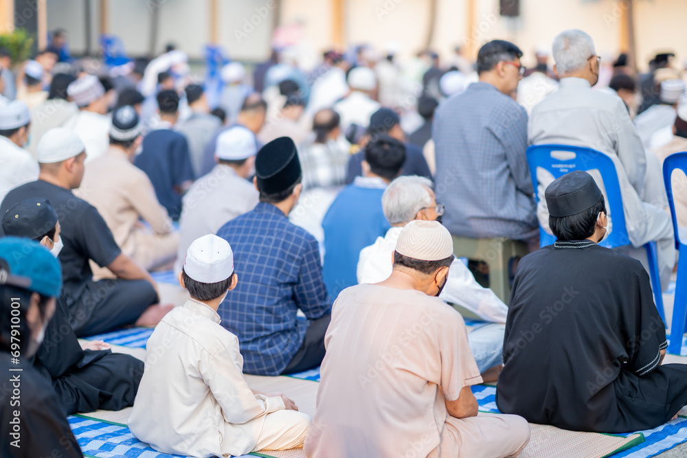 Fototapeta premium Many Muslims, children, women, and men pray and celebrate Eid al-Fitr, Eid mubarak which marks the end of the month of Ramadan, they are happy, in Thailand.