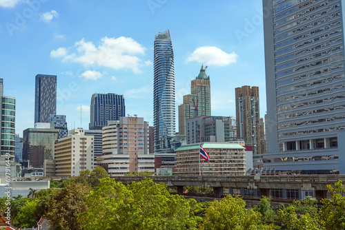 Greee trees park and high-rise buildings cityscape in metropolis city center . Green environment city and downtown business district in panoramic view. photo