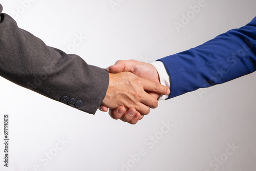 Holding hands with business partners to trust business partners, relationships to achieve future commercial and investment goals