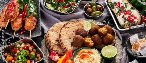 Middle eastern or Arabic different dishes on black background. Tasty traditional food concept © bit24