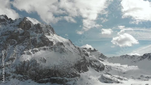 Wallpaper Mural Dynamic drone shot ideal for accelerating into a snowy Dolomites timelapse, with moving clouds, featuring Marmolada and Ciampac ski resort area. Torontodigital.ca