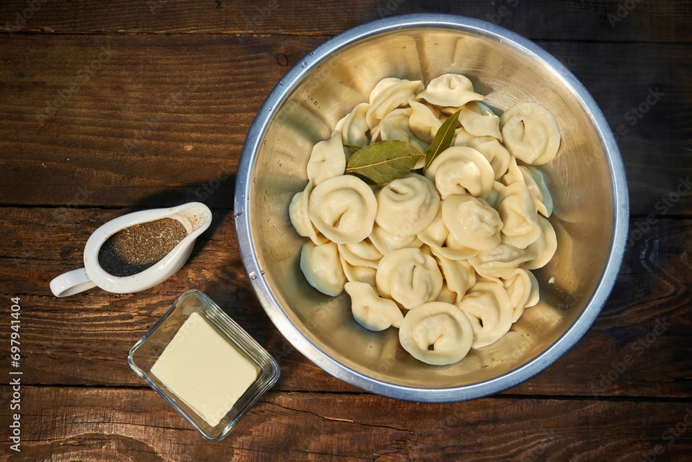 Ready-cooked dumplings in a bowl with spices and butter. Ready-cooked dumplings in a bowl with spices and butter.