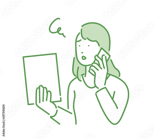 書類の不備を確認する女性