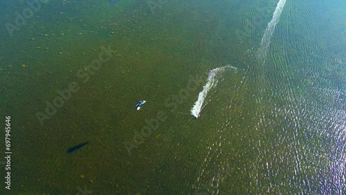 Aerial of Kite surfing at the famous Punta Trettu, San Giovanni Suergiu, South Sardinia, Italy photo