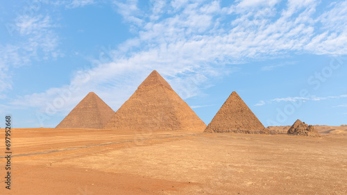 Giza Pyramid Complex with bright blue sky - Cairo, Egypt