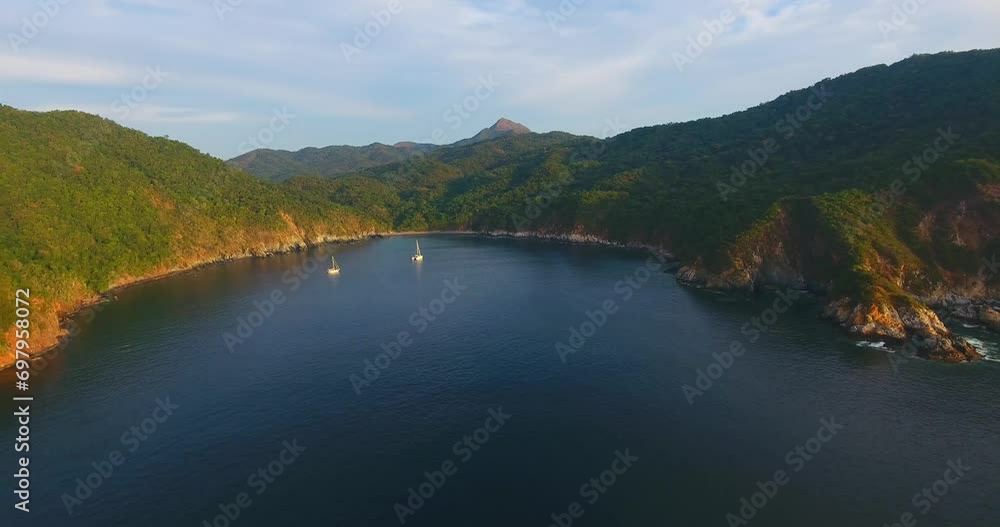 Panning over a gorgeous protected anchorage on a calm day at Carrical near Manzanillo Mexico at sunset Panning over a gorgeous protected anchorage on a calm day at Carrical near Manzanillo Mexico at sunset