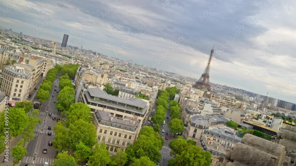 Rotating view of the Eiffel tower in Paris, France from the Arc de Triomphe. Slow Motion 4k
