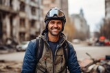 Portrait of a handsome motorcyclist with helmet in the city