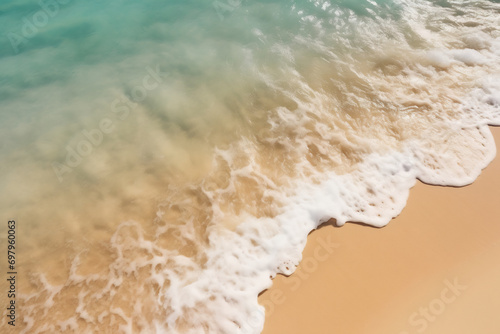 brown sand beside body of water during daytime photo