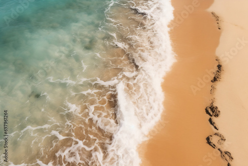 brown sand beside body of water during daytime photo