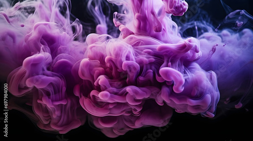 purple and blue colors mixing, smoke effect in water. Thick colorful smoke purple, pink, red, blue on a black isolated background © Riz