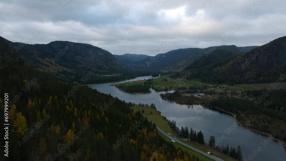 aerial view of Araksfjord valley lake with road and pine forest in norway aerial view of Araksfjord valley lake with road and pine forest in norway