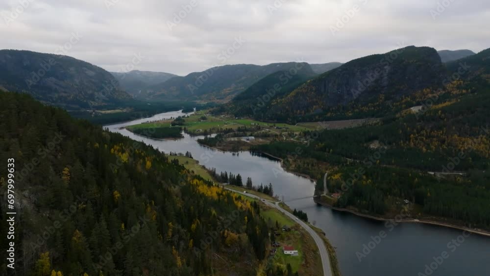 aerial view of Araksfjord valley lake with road and pine forest in norway aerial view of Araksfjord valley lake with road and pine forest in norway