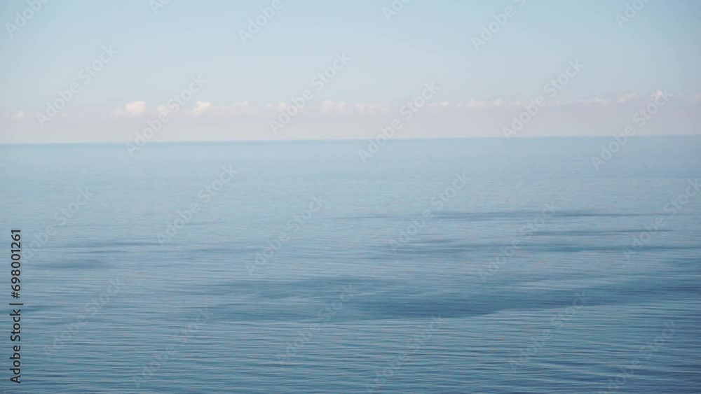 Aerial panoramic view of beautiful sunset above sea. Beautiful seascape. Sun glare, small waves on the water surface. Evening. Horizon. Nobody. No people. Never-ending beauty of nature. Aerial panoramic view of beautiful sunset above sea. Beautiful seascape. Sun glare, small waves on the water surface. Evening. Horizon. Nobody. No people. Never-ending beauty of nature.
