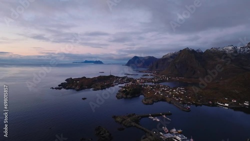 aerial view of sorvagen fishing village and moskenes ferry port during sunrise on lofoten islands in norway photo