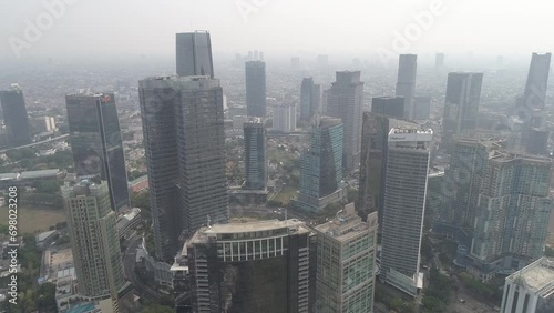 Skyscraper in Jakarta, Indonesia, Cityscape in Sudirman Aerial Drone Footage, Tower and Building in The City photo