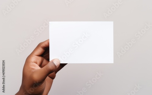 mockup of card for note in person's hand